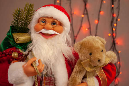 Santa claus in a red suit with gifts