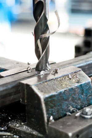 Drill going in a metallic piece of an assemblyの写真素材