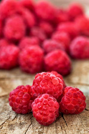 Fresh, organic raspberry on wood background  Health concept with bio-fruits