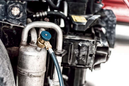 Close-up of car maintainance, working with the air conditionerの写真素材