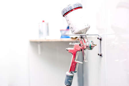 close up of airbrush in autoshop garage service ready for paintingの写真素材