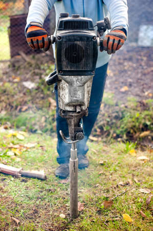 Geological enginner boring and drilling into earth looking for an assay for seismical testing....