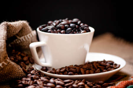 Arabic fresh bio coffee and vintage cloth packaging isolated on blackの写真素材