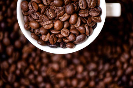 Detail of coffee mug with fresh, bio coffee beansの写真素材