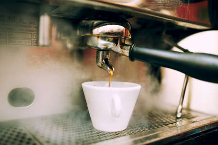 modern coffee and espresso machine pouring coffeeの写真素材