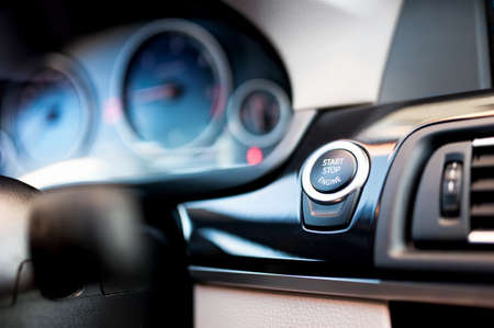 detail close-up of car start and stop button  Modern car interior with minimalstic details
