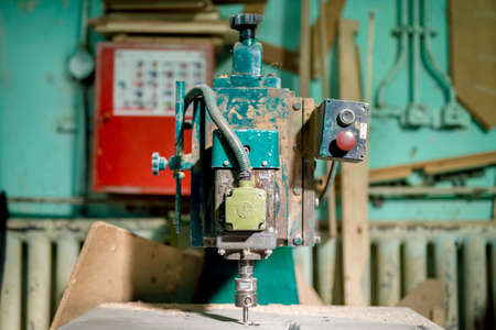 industrial milling tool at local factory. Manual lathe, tools and drills at factory
