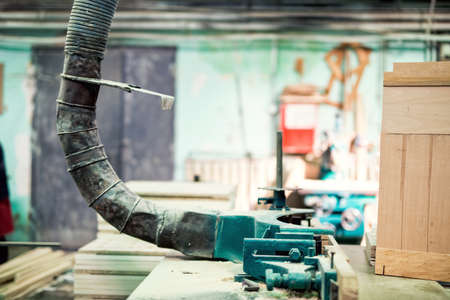 industrial lathe tool, drilling and vacuuming the saw dust from wood processingの写真素材