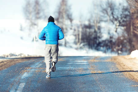Fitness man, jogger running, preparing and training outdoorの写真素材