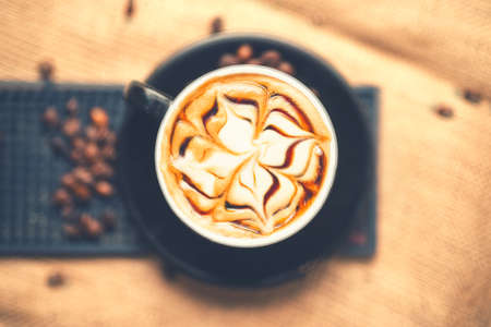 Top view of fresh arabic aromatic espress coffee with milk served in restaurant. Soft effectの写真素材