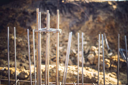Reinforced steel bars on new construction foundation siteの写真素材