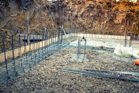 industrial construction site, cement in foundation and reinforcement of steel barsの写真素材