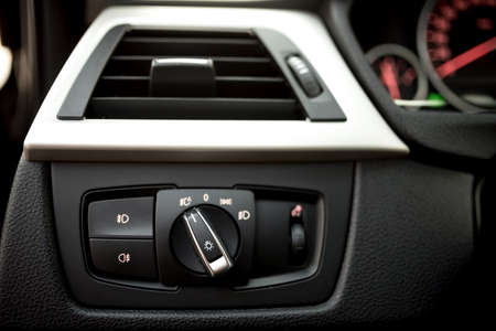 Air conditioning of automobile interior and headlight controls - modern car ventilation system.の写真素材