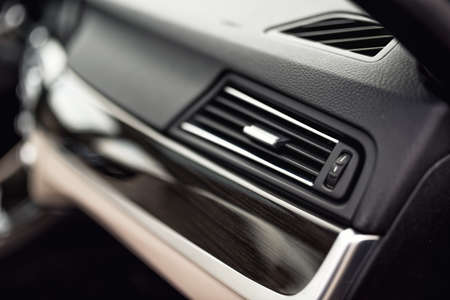 Car ventilation system with adjustment buttons and details of modern carの写真素材