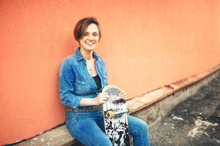Fashion and urban lifestyle, beautiful young woman with longboard, isolated. Soft effectの写真素材
