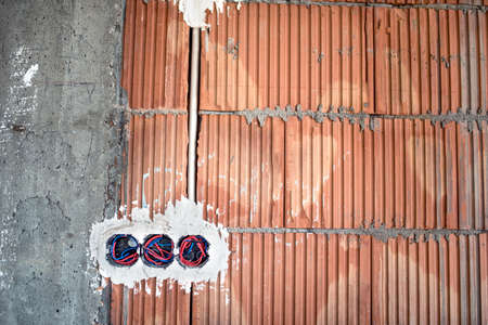 wall sockets, electricity installation at new house construction siteの写真素材