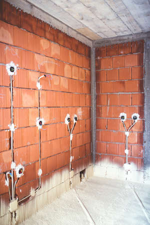 energy efficient house, built with top quality materials, thermal insulation and brick walls with plugs and electricity pipesの写真素材
