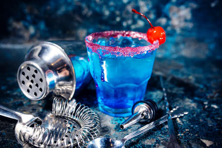 blue cocktail alcoholic drink with fruits and vodka.の写真素材