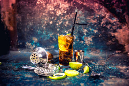 Alcoholic cocktail beverage, cuba libre drink with garnish and metal backgroundの写真素材