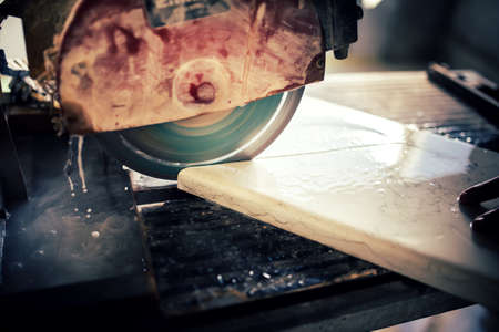 industrial tool, grinder cutting slate. Marble cutting at construction siteの写真素材