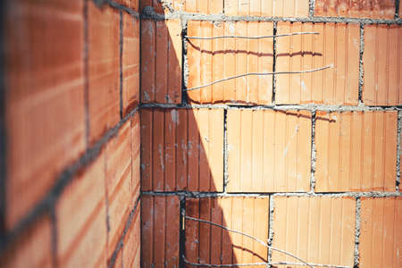 Details of brickwork. Construction site with exterior walls, building detailsの写真素材