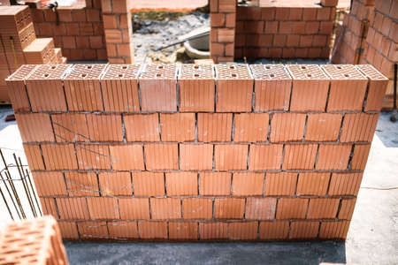 Building construction site with brickwork and bricklaying. Industrial detailsの写真素材