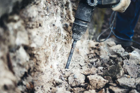 Close up details of construction site with picking drill and pneumatic machineryの写真素材