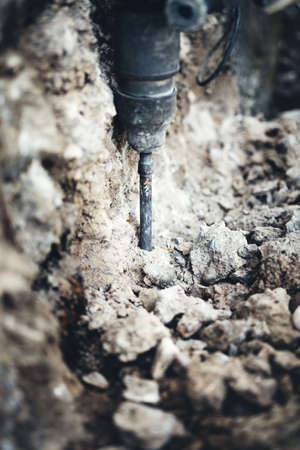 Construction site details with picking drill on industrial machineryの写真素材