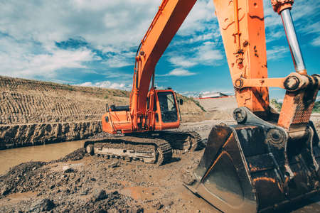 Close-up details of excavator scoop during highway construction works. Industry with machineryの写真素材