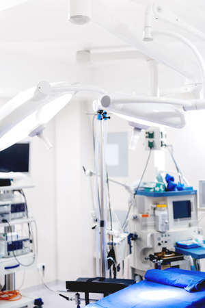 Surgery ready medical room, interior of operating room with surgical lamps. Details of moder...