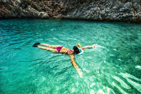 Concept of healthy living, sports and watersport details. Snorkeling with special equipmentの写真素材