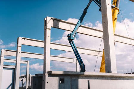 Installation of prefabricated cement pillars and beams on construction siteの写真素材