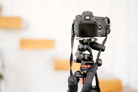 Professional dslr camera standing on tripod and taking interior design photosの写真素材