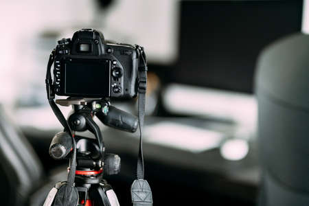 professional photographer taking interior design photos using professional gear, camera and tripod