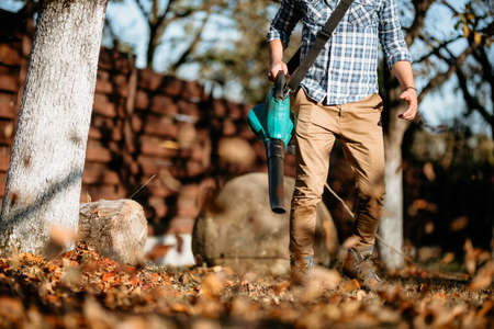 close up details of leaf blower machine, work tools during gardening