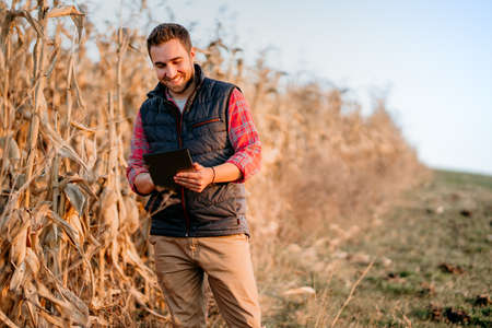 portrait of farmer using tablet in everyday life.