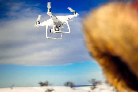 Drone quadcopter flying with high resolution digital camera. Uav operator details