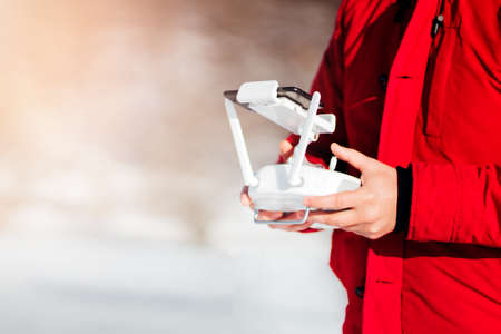 close up details of drones remote control with man piloting the aircraft