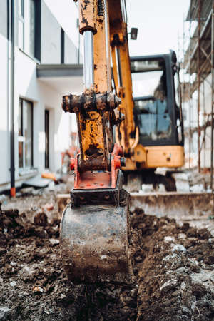 Close up details of construction site excavation. Moving earth with excavator