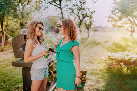 Small group of friends having a barbecue