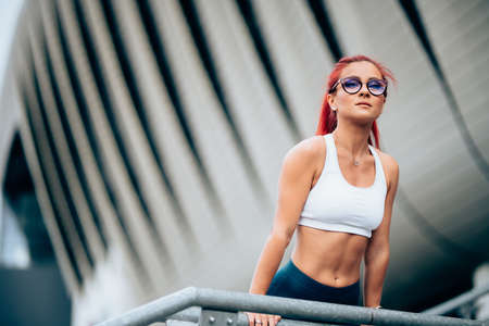 Portrait of attractive sexy woman, caucasian woman working out and wearing sportswear