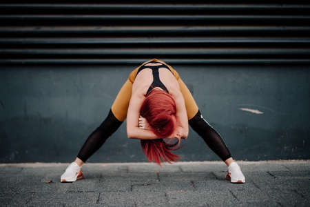 Fitness girl doing fitness exercises and working out.  Jogger on morning training, healthy lifestyle...