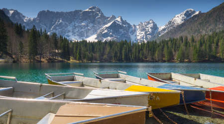 boats near lake lagho di fusine in italyの写真素材