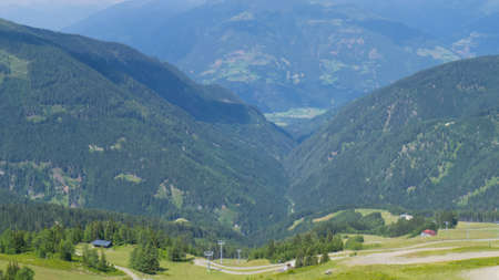 green valley covered with forest on goldeckの写真素材