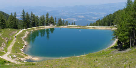 water winter reserves lake from above with view on austrian villages petzenの写真素材
