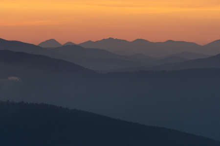 layers of mountains during sunriseの写真素材