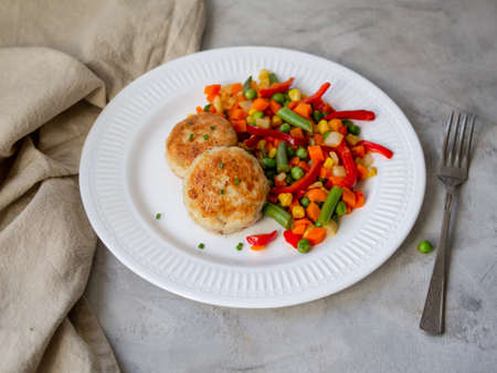 Chicken cutlets with steamed Mix vegetables, Chicken meat balls on white plate. Heathy lunch, diet...