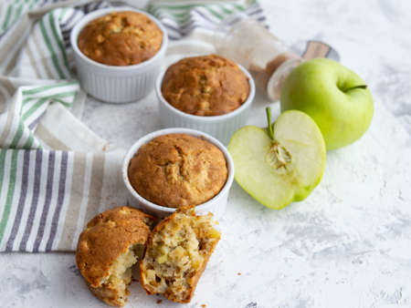 Muffin with cheese and apple. Fresh homemade cakes. Maasdam. Concept of healthy breakfast. Close up. Copy space.の写真素材