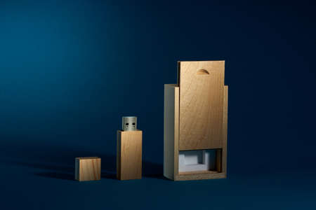 Wooden USB flash drive on blue background.の写真素材