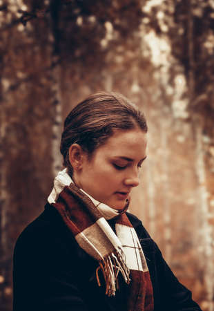 Beautiful girl in the autumn forest.の写真素材